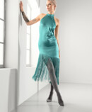 Woman with Juzo Inspiration and tights in poppy and petrol-colored dress