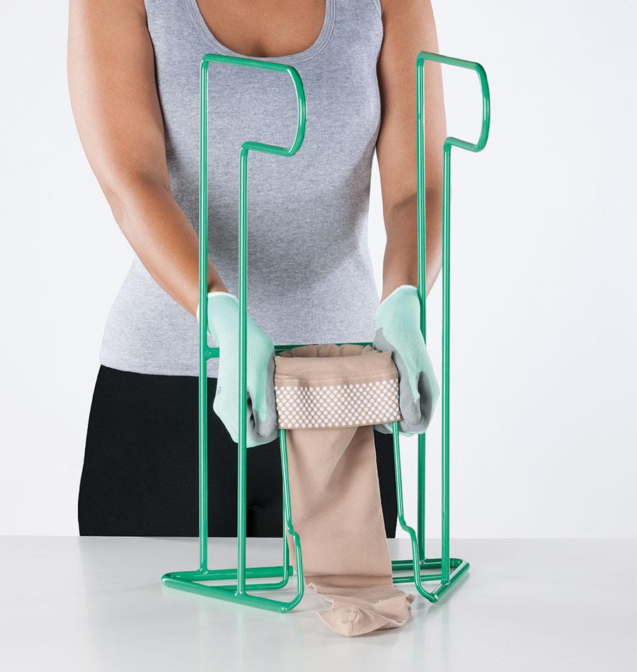 Donning and doffing aids A person demonstrates the Juzo Easy Fit dressing aid